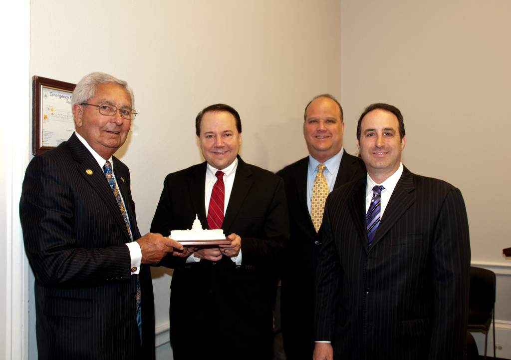 The Honorable Ron Sarasin presents Congressman Tiberi with a marble replica of the Capitol with Phil Blando (Express Scripts) and Mike Zarrelli (Amway).  Express Scripts and Amway provided generous donations to support the event.