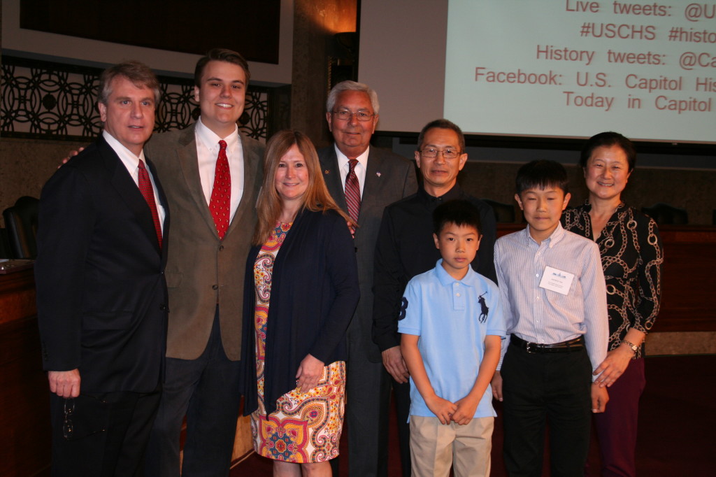 Society President Ron Sarasin (center) with the Merksi and Tan families.