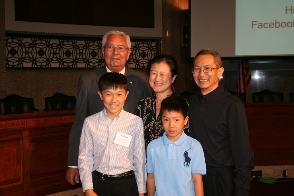 Ron Sarasin with Andrew Tan, his younger brother and their parents.