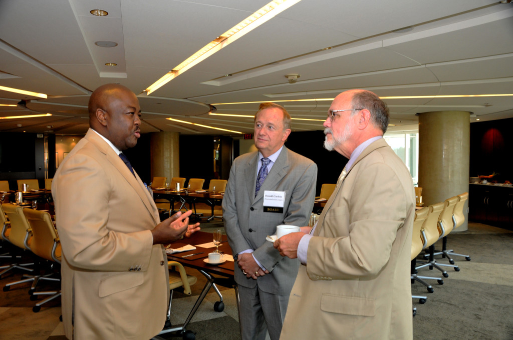 Dontai Smalls (UPS) chats with Donald Carlson (PricewaterhouseCoopers) and Steve Livengood (U.S. Capitol Historical Society).