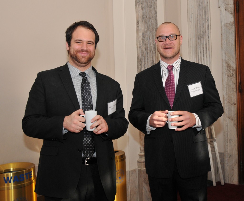 Andrew Tanguay (Sanofi) and Jonah Houts (Express Scripts) enjoy cups of coffee.
