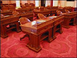 The California Senate’s forty members sit at original ornate walnut desks crafted in 1869 by John Breuner, Sacramento’s leading custom furniture maker. The desks have been faithfully restored by reference to period photographs.