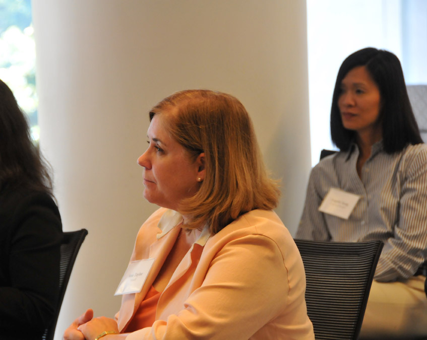 Ann Taylor (Sanofi) listens thoughtfully as Angela Song (Express Scripts) looks on.