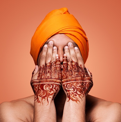 Guards at the Taj promo image with turban and hennaed hands
