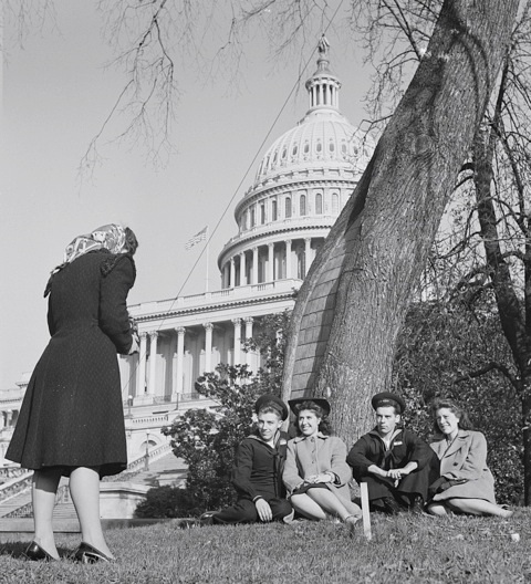 Government girls and their dates play tourist on the Capitol lawn in 1943.