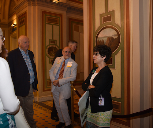 Dr. Michele Cohen, Curator for the Architect of the Capitol, speaks to a group.