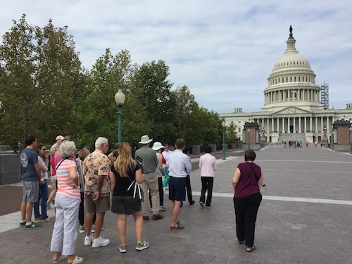 Carla Smith guides a group on the Capitol plaza.