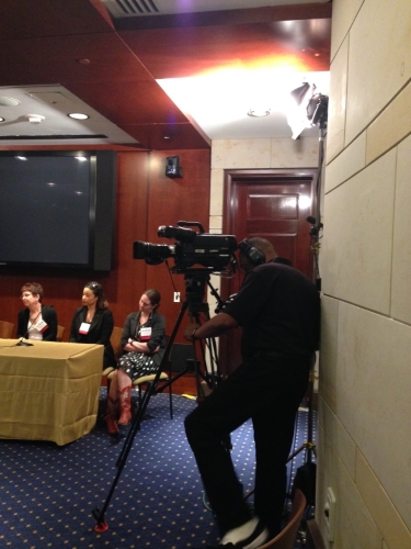 C-SPAN films while the panel of speakers takes questions from the audience.