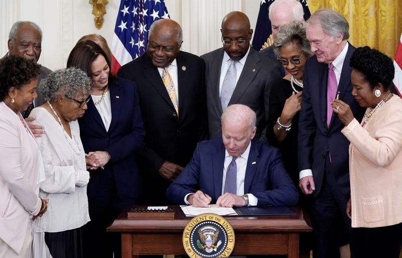 On June 17, 2021 President Joe Biden signed, with Members of Congress, the Juneteenth National Independence Day Act at the White House. (Evan Vucci/AP)
